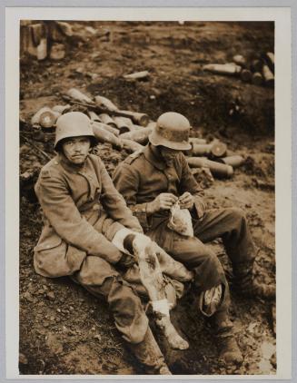 D.2041. Battle of Menin Road - two youthful Hun prisoners waiting their turn for their wounds to be dressed outside a dressing station