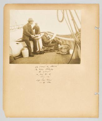 On board "The Stellata", Mr. Nillis studying the chart, on way to the "Goose Arm", Capt Thos. Boland at the wheel. Page 21 of Newfoundland from Collection of Canadian albums compiled by Edith S. Watson
