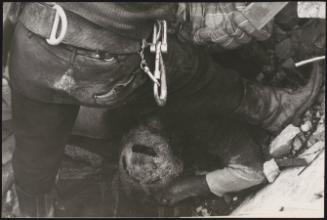 The body of a victim, face down in rubble, in the aftermath of the Friuli earthquake, 1976