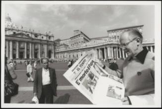 A man holds a newspaper with the headline: 'The Pope is dead' in St. Peter's Square, following the death of Pope John Paul I, on 28 September 1978