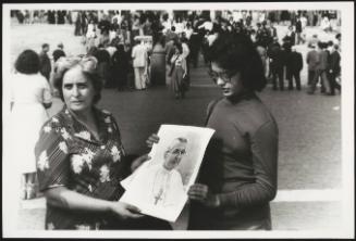 Two women in St. Peter's Square hold a photograph of recently deceased Pope John Paul I