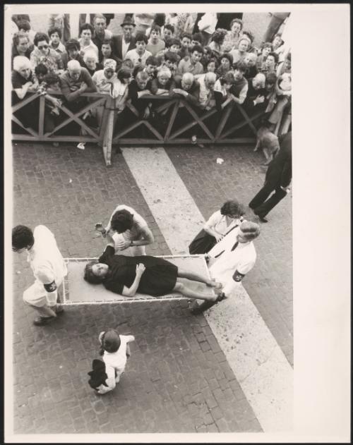 A woman is carried away on a stretcher at a religious congregation in St. Peter's Square, during a speech by Pope John Paul II