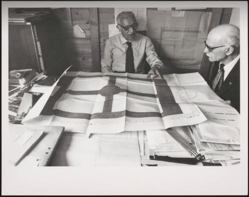  Engineer Tito de Micheli reviewing drawings and plans