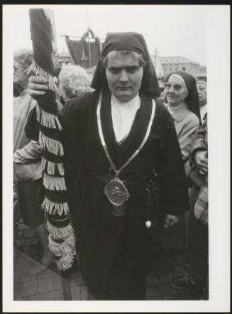A nun holds a rolled up banner at the 1984 Youth Jubilee in Rome.
