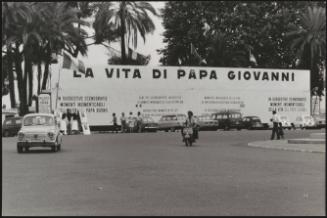 A billboard for an exhibition of wax figures inspired by the life of Pope John XXIII