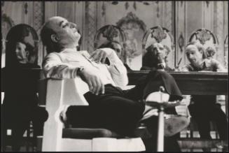 Paolo Bonacelli wearing a mask on a film set