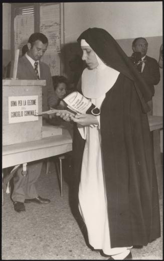 A nun casts her vote at a polling station in Rome