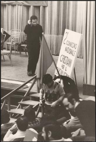 People stepping down from the stage at a Christians for Socialism meeting