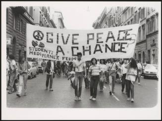 Medical students walk down the street at a protest