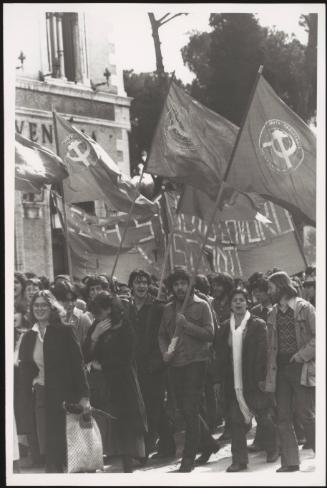 A group of protesters march with their communist flags