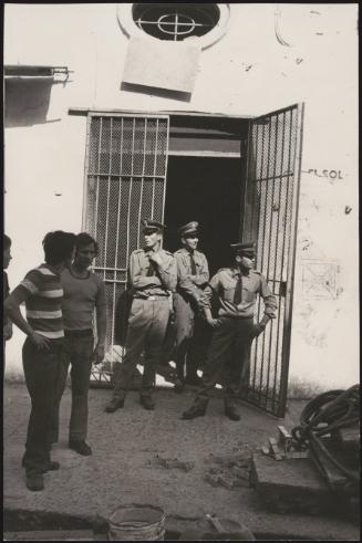 Police guard a doorway, Naples