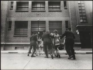 Fashionable young women being arrested by police