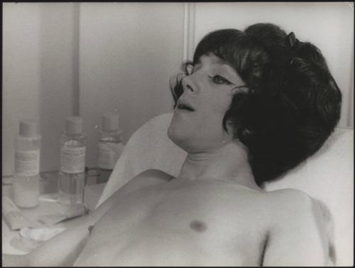 A man in a wig on a film set