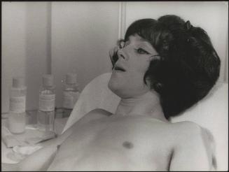 A man in a wig on a film set
