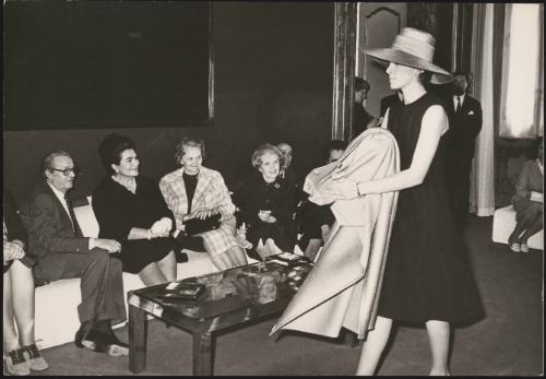 Josip Tito with his wife Jovanka Broz watch a fashion show