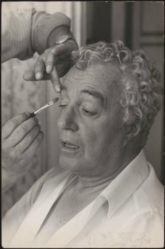 An actor having make-up applied