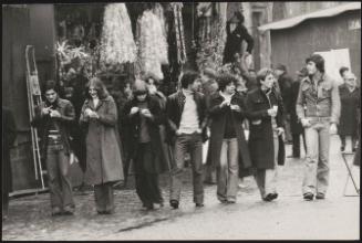Street scene with young people eating gelati