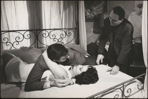 Damiano Damiani talks to his stars Rosanna Schiaffino  and Richard Johnson whilst they lie embracing on a bed on set of 'The witch in Love'