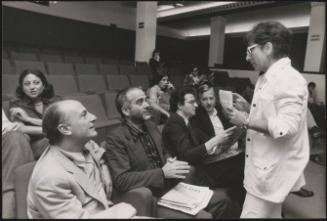 Lina Wertmüller in a theatre with others including Raffaele La Capria