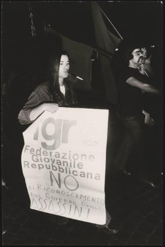 Protester carries an anti-youth-Communist-party banner