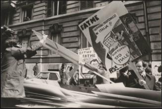 Protesters hand out placards 