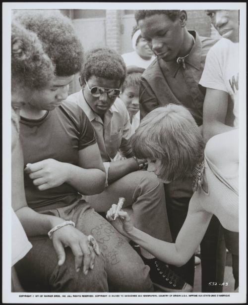 Jane Fonda signing autographs on fans' jeans during the filming of 'Klute'