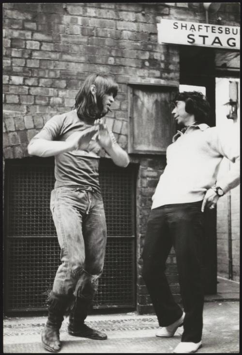 Oliver Tobias and companion stand outside the stage door of the Shaftesbury theatre during the run of 'Hair'