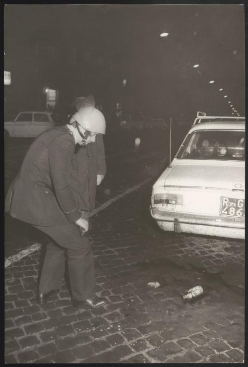 Riot policeman and petrol bomb 