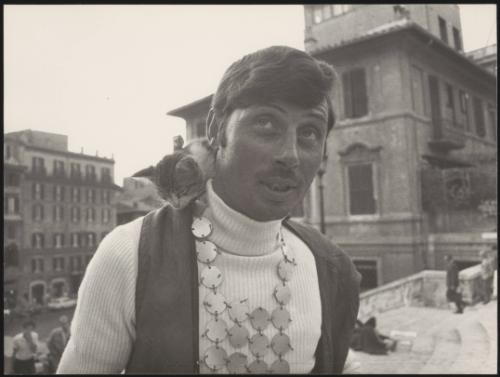 Fashionable man with his pet kitten