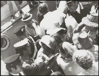 Police hold back angry townspeople as the Mafia disembark, Filicudi, May 1971