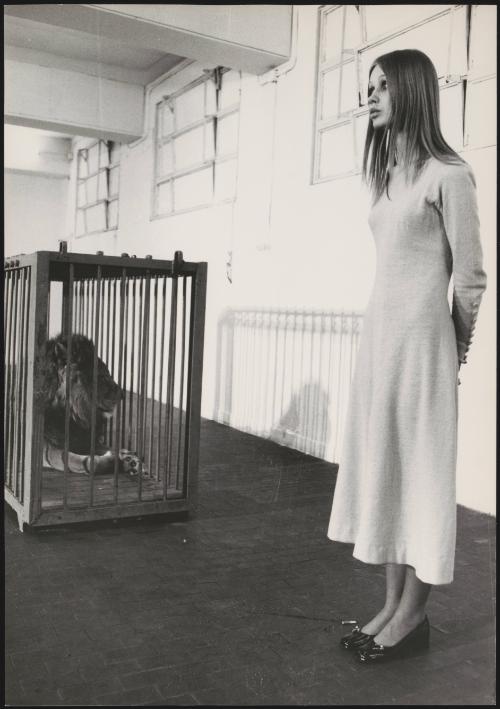 Portrait of a model and a lion during a performance art piece based on the Zodiac