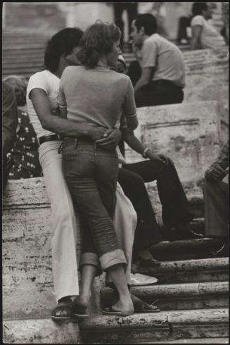 An Italian 'Pappagalli' man with his female tourist on the Spanish Steps, Rome
