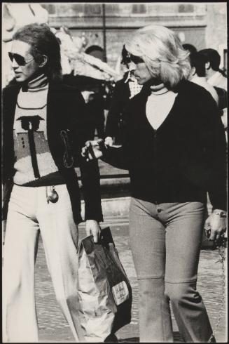 Two gay men in a busy street