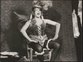 A woman singing during a  cabaret performance for the LGBT community 