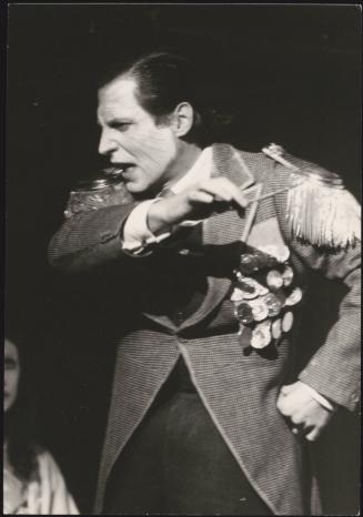 A man dressed in theatrical costume