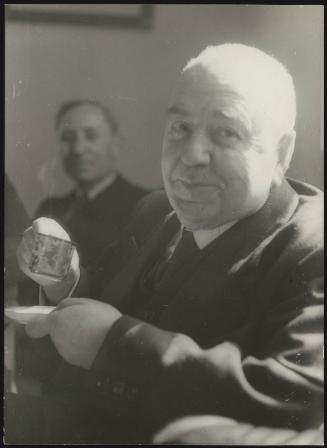 Former Prime Minister of Italy, Francesco Saverio Nitti, holding an espresso cup