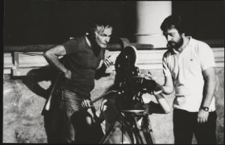 Portrait of Hungarian director Miklós Jancsó at work on set