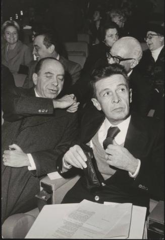 Enrico Berlinguer and Thomas Morlino sit together at an unspecified political event 