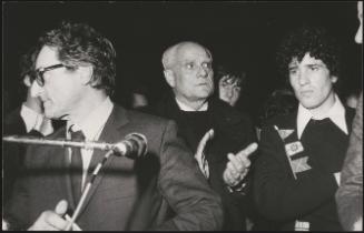 Politician Aldo Tortorella, writer Alberto Moravia and actor Ninetto Davoli photographed at the funeral of Pier Paolo Pasolini