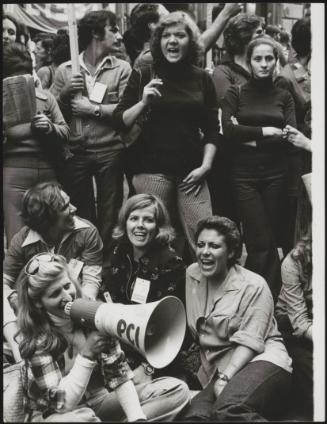 Group of women from the 'Servizio D'Ordine' (Communist party members in charge of keeping order during demonstrations) using a megaphone at a Trade Union demonstration in Rome