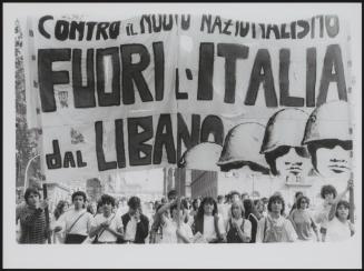 A protest march under a huge banner against the war in Lebanon 'Against new nationalists. Italy out of Lebanon'