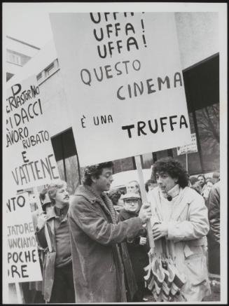A small crowd including actor Andrea Giordana, picket a cinema in a demonstration about the Italian film industry 