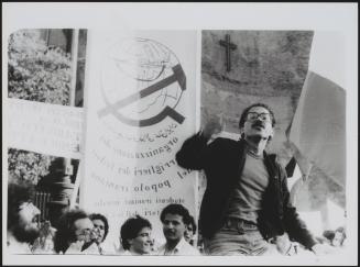 A group of Iranian students gather with banners calling for democracy in the USSR