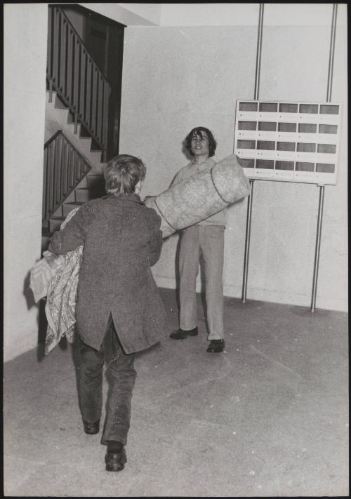 Two squatters move into an apartment block