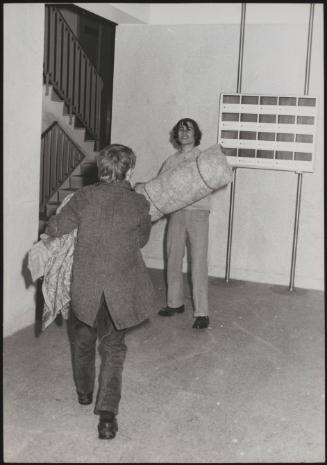 Two squatters move into an apartment block