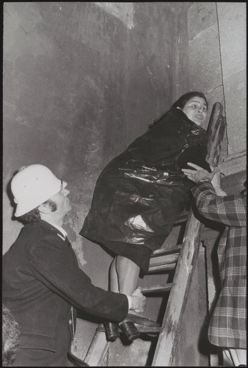 A woman being forcibly evicted from her squat