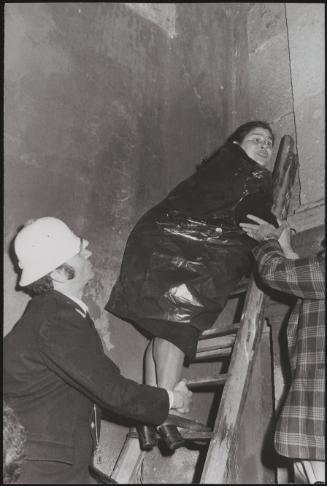 A woman being forcibly evicted from her squat