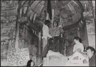 A family put up protest posters after being evicted form their home