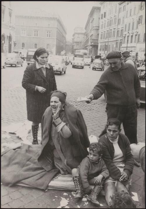 A family protest outside government offices after being evicted from their house
