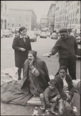A family protest outside government offices after being evicted from their house